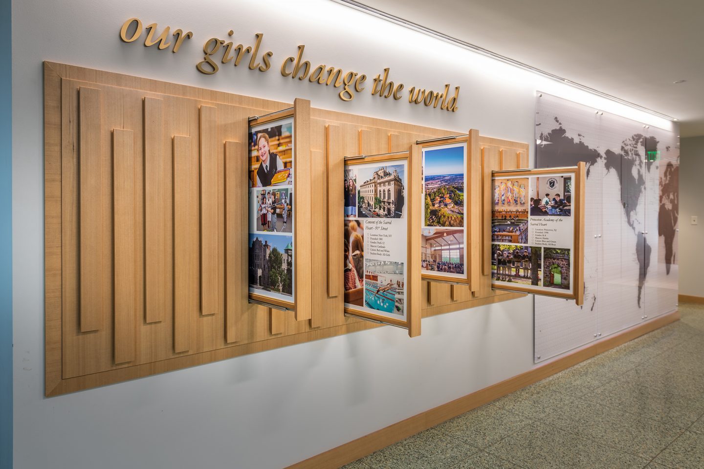 Image of interactive display. The sign above the display says "Our girls change the world."