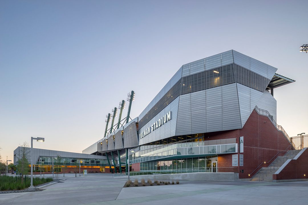 Image of Yulman Stadium from the pedestrian entry plaza at dusk