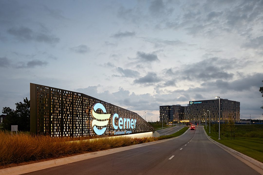 Image of the entrance to the former Oracle Cerner Continuous Campus. Large signage saying "Cerner" welcomes one to the campus.
