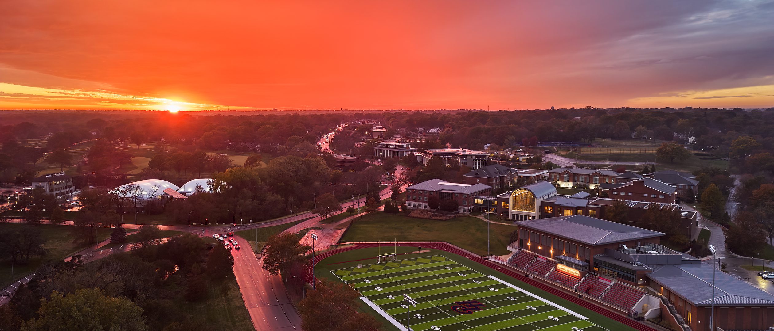 Aerial photo of Pembroke Hill School as the sun sets in the distance.
