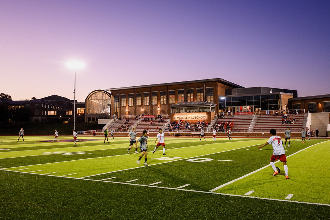 Photo of Bellis Athletics Center with a varsity soccer game being played on adjacent Hicks Field.